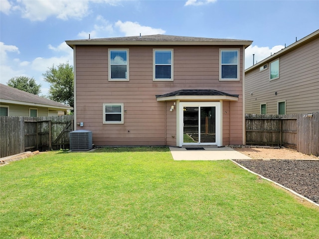 26118 Flinton Dr, Richmond, TX 77406 - rear view of house featuring central air condition unit and a patio