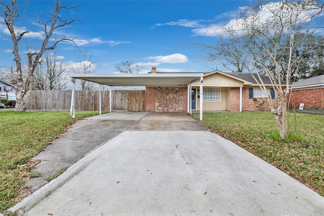 7730 Wickersham Pl, Beaumont, TX 77706 - single story home featuring driveway, a carport, and brick siding