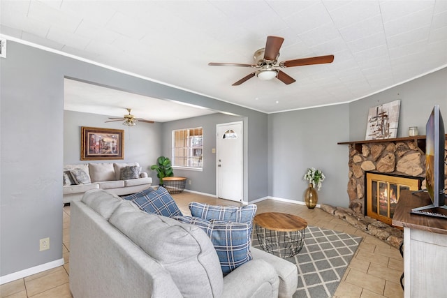 7730 Wickersham Pl, Beaumont, TX 77706 - tiled living area with a ceiling fan, a fireplace, baseboards, and crown molding