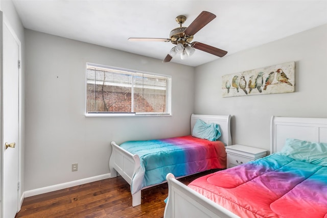 7730 Wickersham Pl, Beaumont, TX 77706 - bedroom featuring dark wood finished floors, baseboards, and a ceiling fan