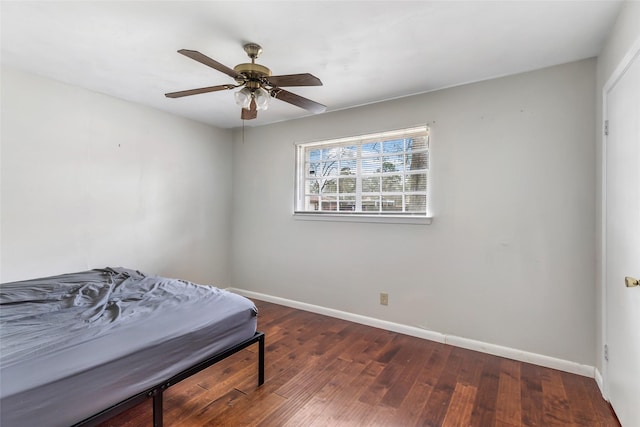 7730 Wickersham Pl, Beaumont, TX 77706 - bedroom featuring wood finished floors, baseboards, and a ceiling fan