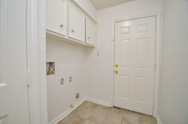 clothes washing area with washer hookup, cabinet space, baseboards, and hookup for an electric dryer