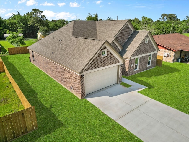 view of front of house featuring a shingled roof, an attached garage, brick siding, and concrete driveway
