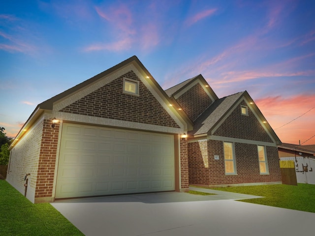 view of front facade featuring concrete driveway, brick siding, a garage, and a front lawn