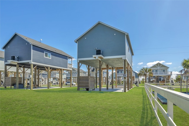 1079 Cedar Ln, Gilchrist, TX 77617 - back of property featuring a lawn