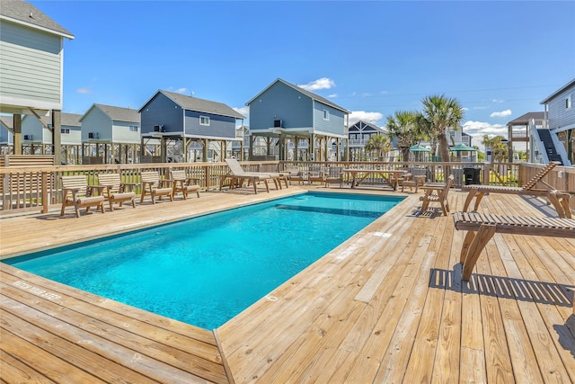 1079 Cedar Ln, Gilchrist, TX 77617 - view of pool with a deck and a residential view