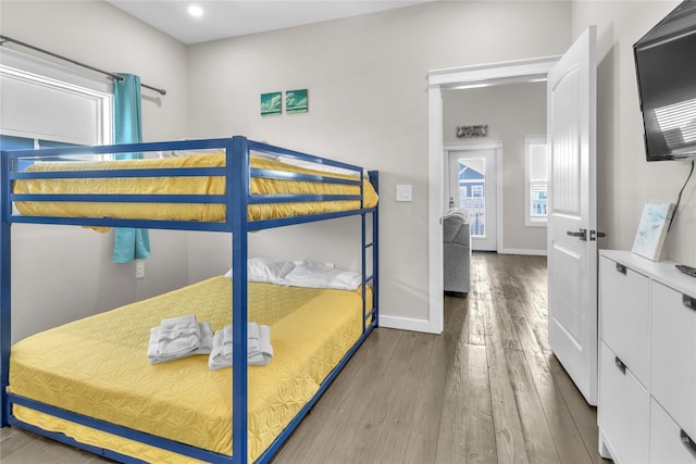 1079 Cedar Ln, Gilchrist, TX 77617 - bedroom with wood finished floors, baseboards, and recessed lighting