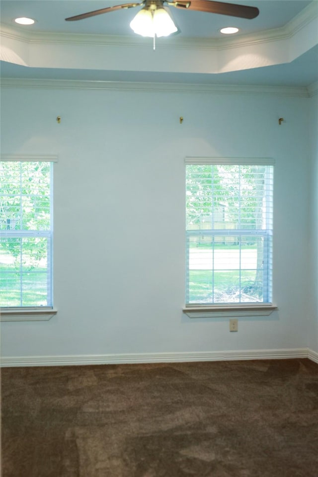 5468 Hogaboom Rd, Groves, TX 77619 - carpeted empty room with ceiling fan, crown molding, plenty of natural light, a raised ceiling, and baseboards