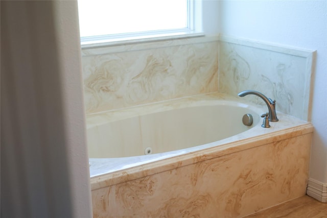5468 Hogaboom Rd, Groves, TX 77619 - full bathroom featuring a garden tub