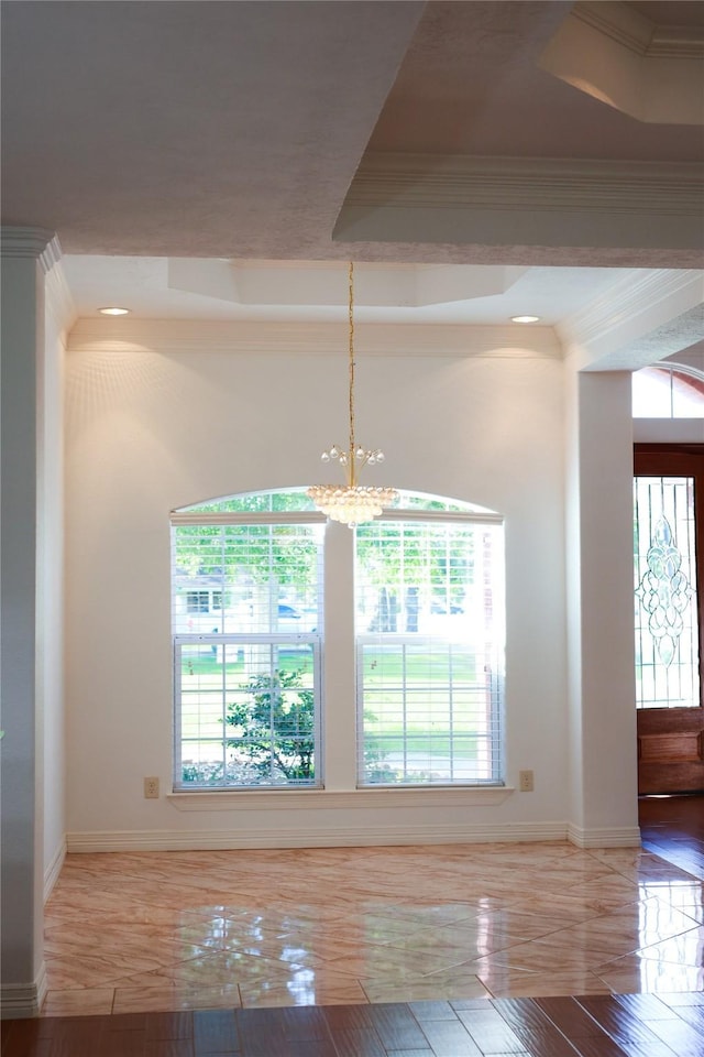 5468 Hogaboom Rd, Groves, TX 77619 - unfurnished dining area with baseboards, a chandelier, a raised ceiling, and crown molding