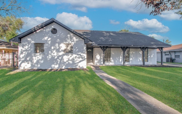 ranch-style house featuring a front yard, central air condition unit, brick siding, and a shingled roof