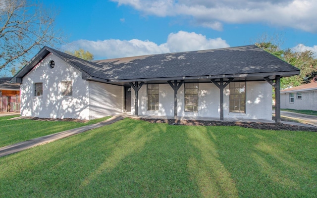 ranch-style house with a shingled roof, a front lawn, brick siding, and a porch