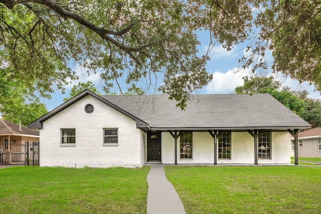 5230 W Bellfort Ave, Houston, TX 77035 - view of front of home with brick siding, roof with shingles, and covered porch