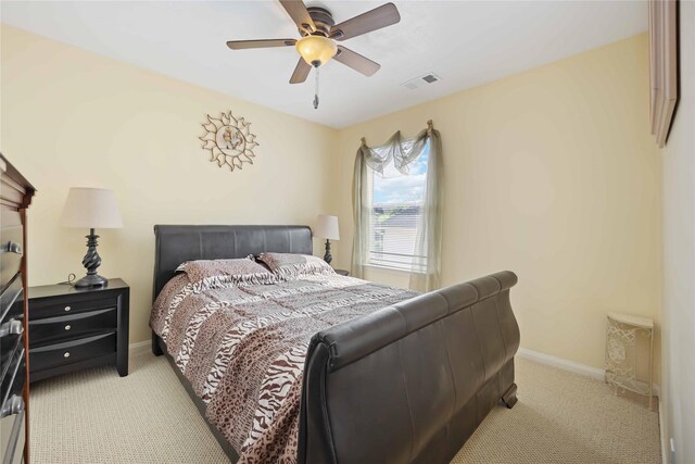 17906 Camden Oaks Ln, Richmond, TX 77407 - bedroom featuring light colored carpet, ceiling fan, and baseboards