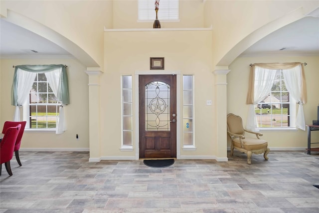 17906 Camden Oaks Ln, Richmond, TX 77407 - entrance foyer featuring arched walkways, healthy amount of natural light, baseboards, and ornamental molding