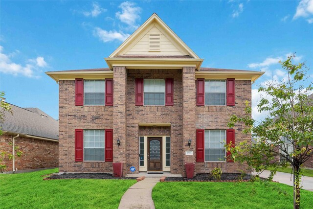 17906 Camden Oaks Ln, Richmond, TX 77407 - view of front of home featuring brick siding and a front yard