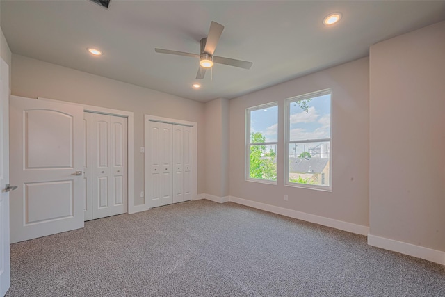 7207 Force St, Houston, TX 77020 - unfurnished bedroom featuring two closets, carpet flooring, baseboards, recessed lighting, and ceiling fan