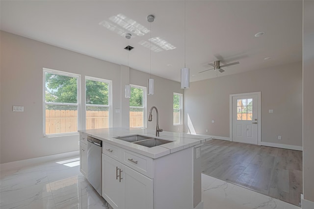 7207 Force St, Houston, TX 77020 - kitchen with a sink, light marble finish flooring, stainless steel dishwasher, an island with sink, and pendant lighting