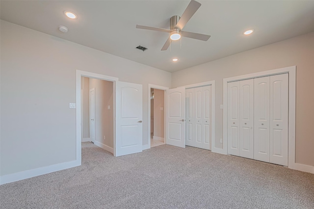 7207 Force St, Houston, TX 77020 - unfurnished bedroom featuring light colored carpet, two closets, baseboards, recessed lighting, and ceiling fan