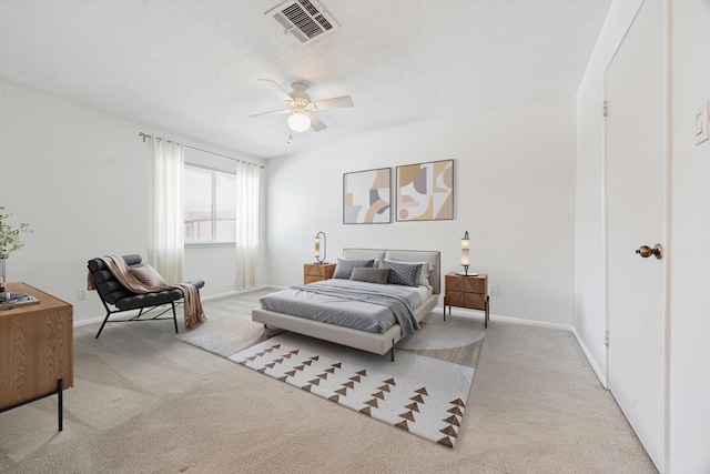 2515 Bering Dr Unit 11, Houston, TX 77057 - bedroom with carpet, baseboards, and a ceiling fan