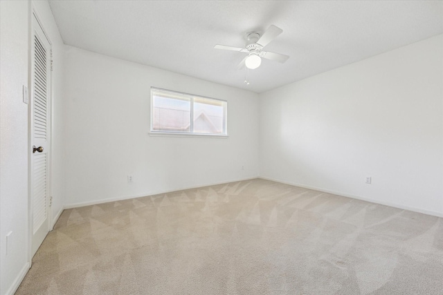 2515 Bering Dr Unit 11, Houston, TX 77057 - unfurnished bedroom with light carpet, ceiling fan, and a closet