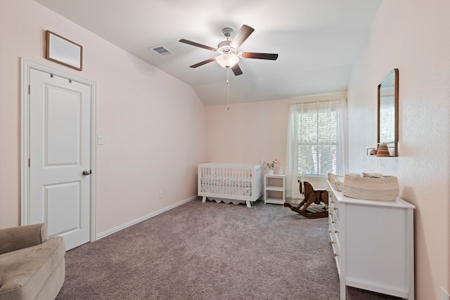 315 Cadela Dr, Montgomery, TX 77316 - carpeted bedroom featuring lofted ceiling, a nursery area, a ceiling fan, and baseboards