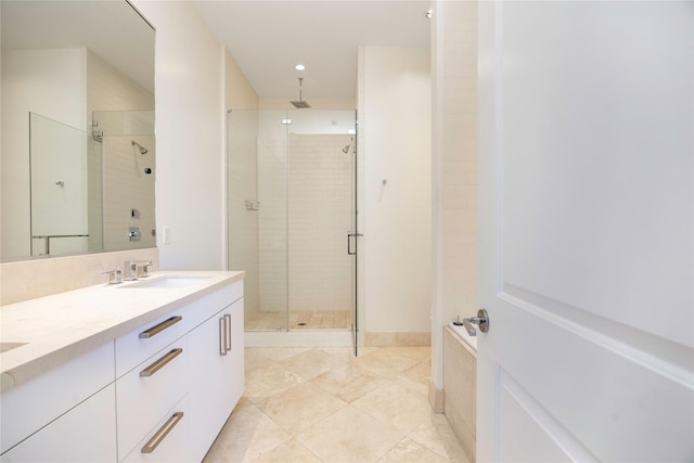 bathroom featuring a shower stall, double vanity, tile patterned floors, and recessed lighting