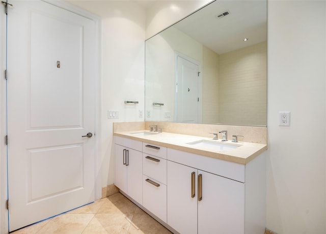 bathroom featuring double vanity and tile patterned flooring