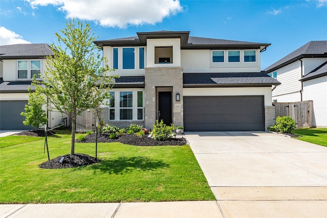 21811 Gibson Desert Dr, Cypress, TX 77433 - prairie-style house with stucco siding, a garage, concrete driveway, and stone siding