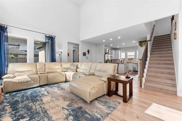 21811 Gibson Desert Dr, Cypress, TX 77433 - living area with stairway and light wood-style flooring