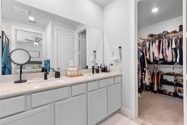 21811 Gibson Desert Dr, Cypress, TX 77433 - ensuite bathroom featuring double vanity, a ceiling fan, a walk in closet, and recessed lighting