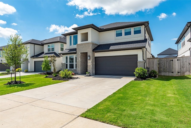 21811 Gibson Desert Dr, Cypress, TX 77433 - prairie-style home with stucco siding, a garage, concrete driveway, stone siding, and a shingled roof