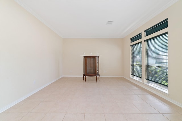 12236 S Shadow Cove Dr, Houston, TX 77082 - empty room with crown molding, baseboards, and light tile patterned flooring
