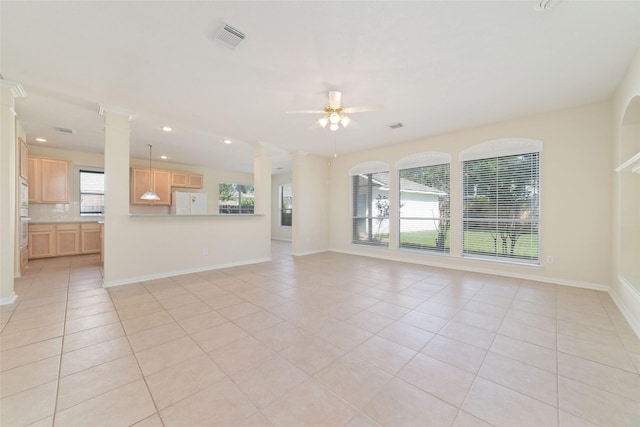 12236 S Shadow Cove Dr, Houston, TX 77082 - unfurnished living room with ornate columns, light tile patterned floors, a ceiling fan, baseboards, and recessed lighting