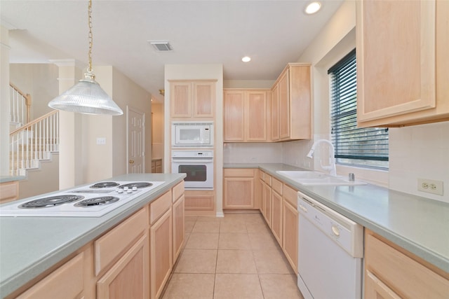 12236 S Shadow Cove Dr, Houston, TX 77082 - kitchen featuring light brown cabinetry, white appliances, a sink, light countertops, and recessed lighting