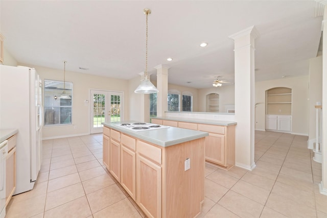 12236 S Shadow Cove Dr, Houston, TX 77082 - kitchen with light brown cabinets, light tile patterned floors, white appliances, ceiling fan, and a center island