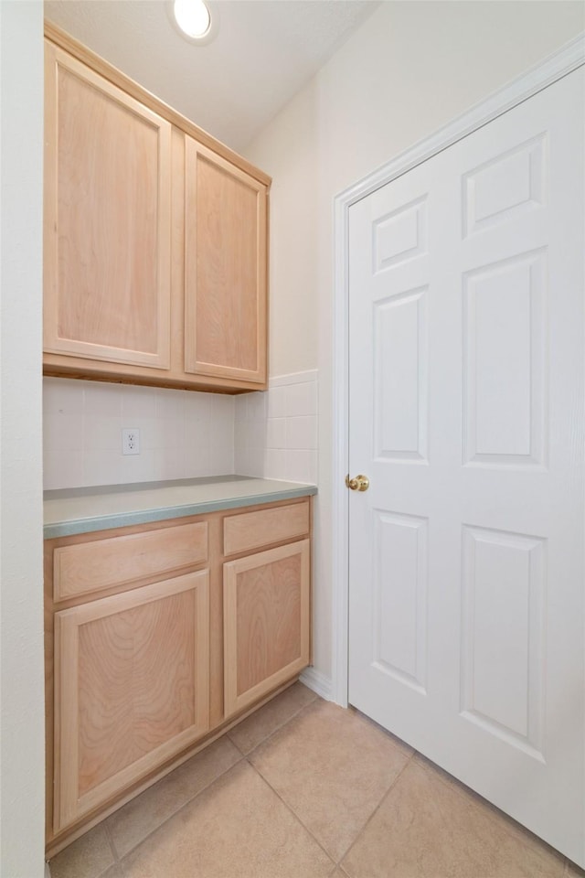 12236 S Shadow Cove Dr, Houston, TX 77082 - clothes washing area with light tile patterned floors