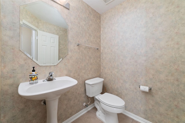 12236 S Shadow Cove Dr, Houston, TX 77082 - half bath with toilet, tile patterned flooring, and baseboards