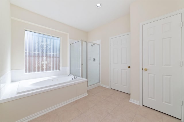 12236 S Shadow Cove Dr, Houston, TX 77082 - bathroom with a shower stall, a bath, and tile patterned floors