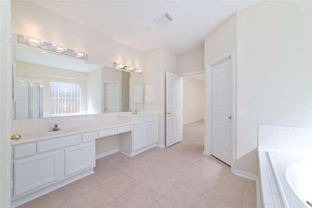 12236 S Shadow Cove Dr, Houston, TX 77082 - full bathroom with a bath, double vanity, a shower with door, baseboards, and tile patterned floors