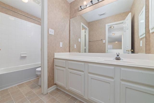 12236 S Shadow Cove Dr, Houston, TX 77082 - bathroom featuring toilet, vanity, tile patterned floors, and shower / tub combination