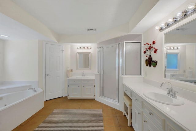 2810 Cottonwood Dr, Katy, TX 77493 - bathroom with tile patterned floors, a stall shower, a garden tub, and two vanities
