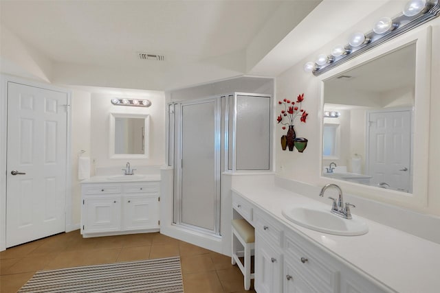 2810 Cottonwood Dr, Katy, TX 77493 - full bathroom with tile patterned flooring, two vanities, and a stall shower