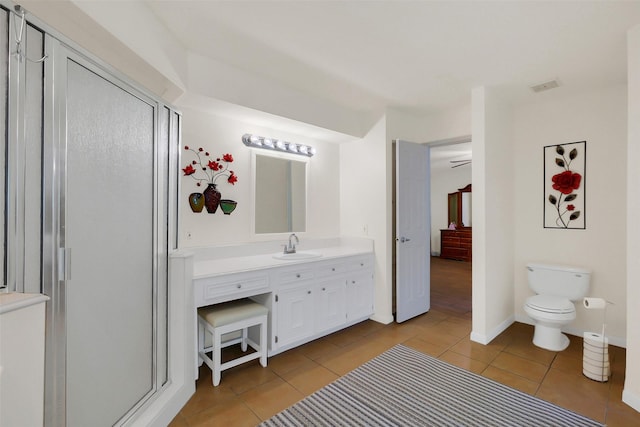 2810 Cottonwood Dr, Katy, TX 77493 - full bath featuring tile patterned flooring, vanity, a shower stall, and toilet