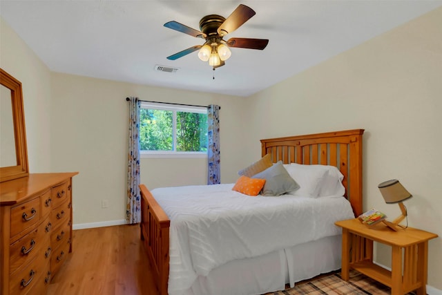 2810 Cottonwood Dr, Katy, TX 77493 - bedroom featuring light wood finished floors, baseboards, and a ceiling fan