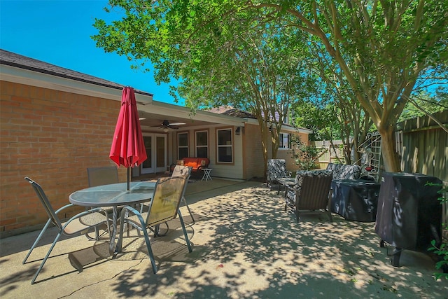 2810 Cottonwood Dr, Katy, TX 77493 - view of patio / terrace featuring a ceiling fan, fence, outdoor dining area, and french doors
