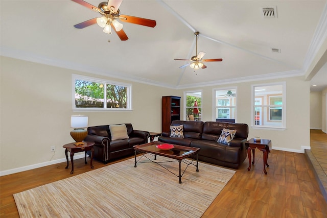 2810 Cottonwood Dr, Katy, TX 77493 - living area featuring a ceiling fan, plenty of natural light, wood finished floors, lofted ceiling, and crown molding