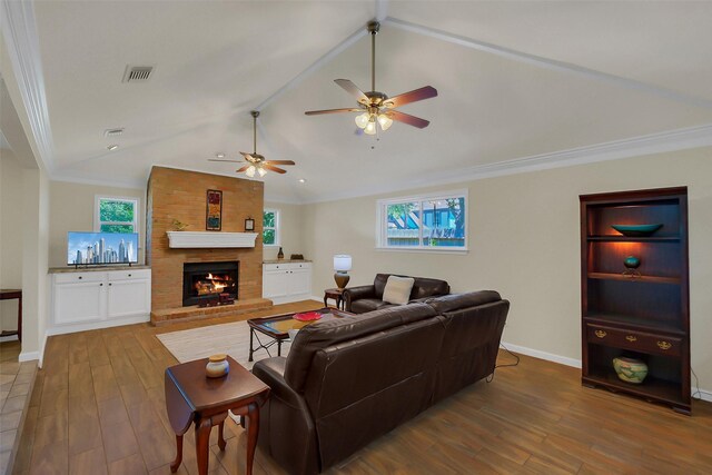 2810 Cottonwood Dr, Katy, TX 77493 - living area featuring a ceiling fan, wood finished floors, a brick fireplace, baseboards, and vaulted ceiling