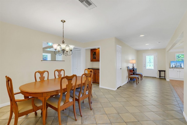 2810 Cottonwood Dr, Katy, TX 77493 - dining area with a chandelier, baseboards, light tile patterned flooring, and recessed lighting