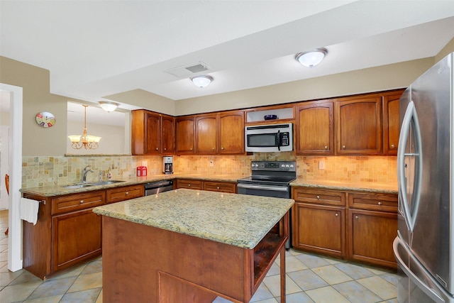 2810 Cottonwood Dr, Katy, TX 77493 - kitchen featuring black appliances, a sink, light tile patterned flooring, and brown cabinets